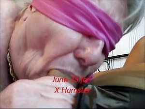 Blindfolded granny sucks close-up